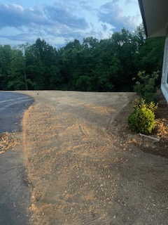 Driveway transformation project showing before/during work with patches being repaired